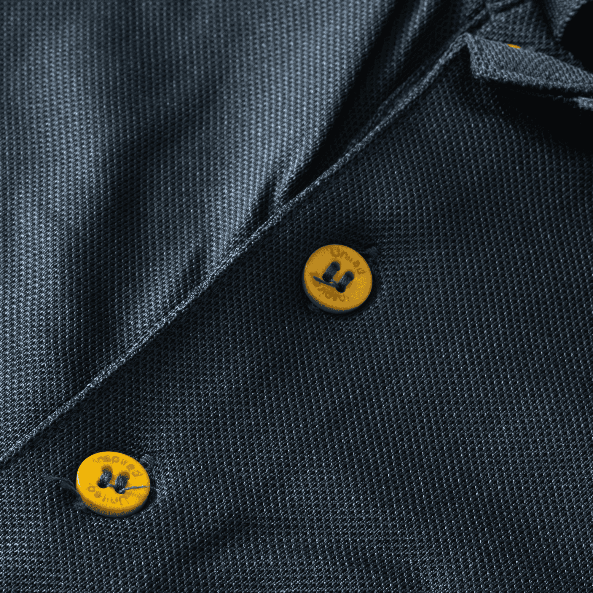 grey polo shirt with yellow buttons up close