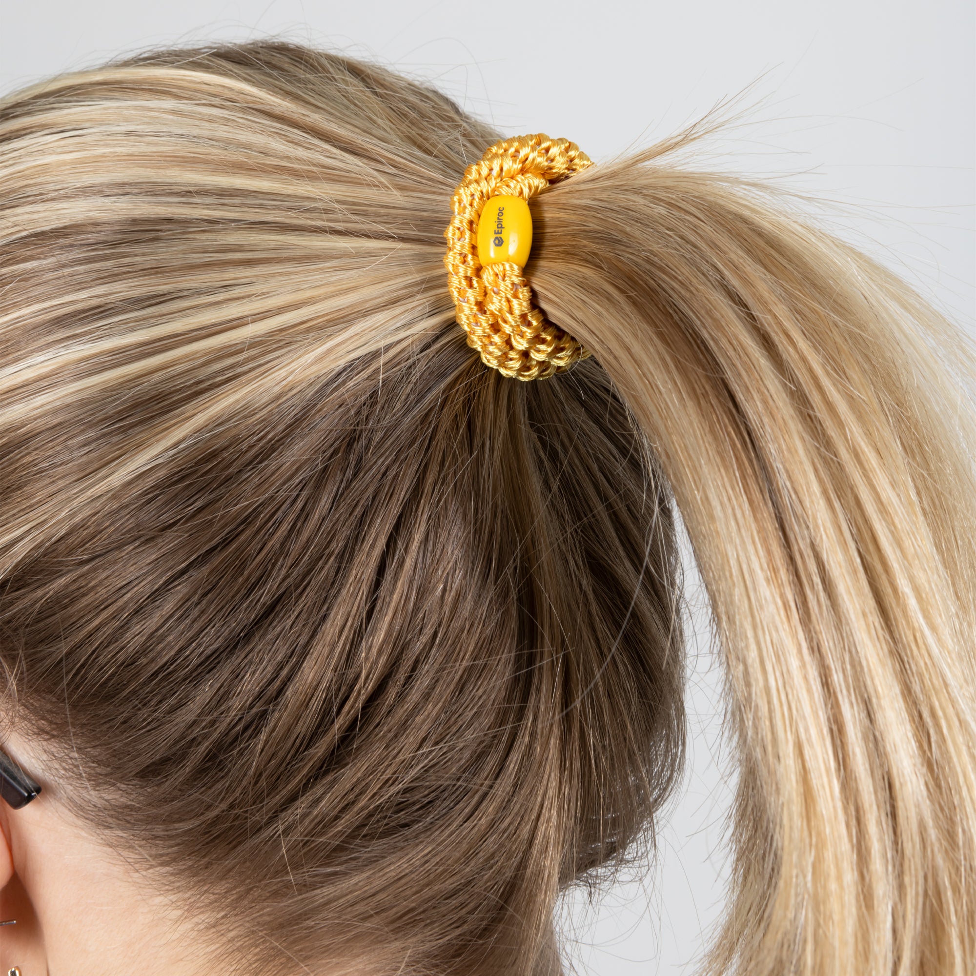 yellow hair tie with epiroc logo